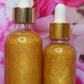 Penelope's Shop Gold Shimmering Oil Back of bottles